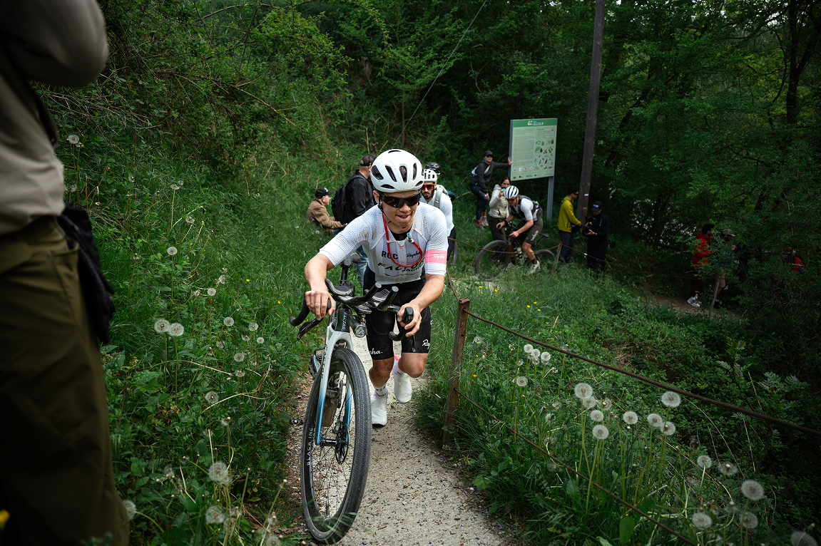 victor bosoni walking his bike up a steep incline